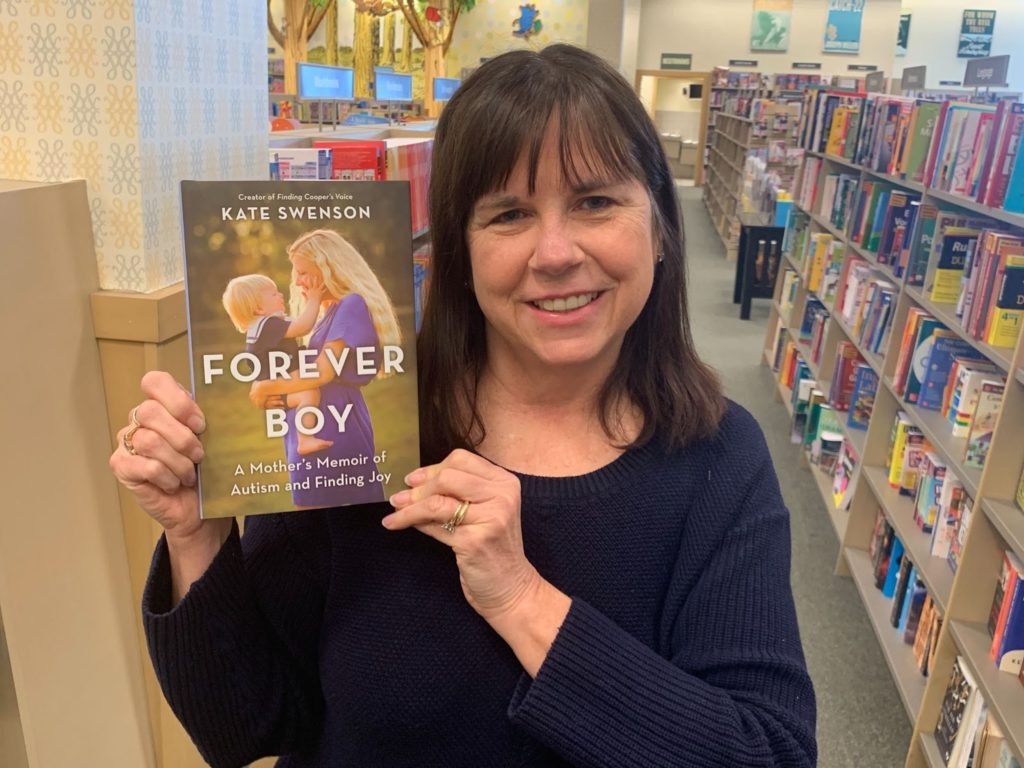 Dr. Mary Barbera holding copy and endorsing Kate Swenson's book, Forever Boy